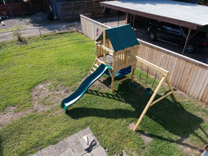 The Explorer Space Saver Swing Set from The SwingSet Co. is great for family time and outdoor play. This playground has many activities. It is a great small backyard playset with many accessories including an extra large fort, belt swings, trapeze bar, 10’ wave slide, 6’ rock climbing wall and under fort hammock.